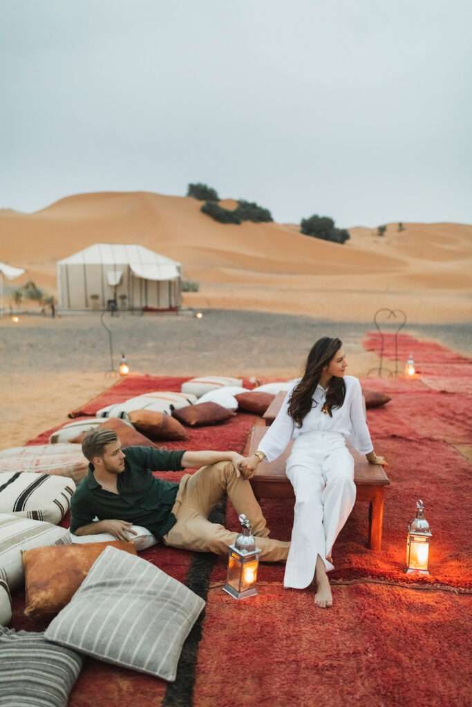 comfy tourists cozy in a moroccan desert camp